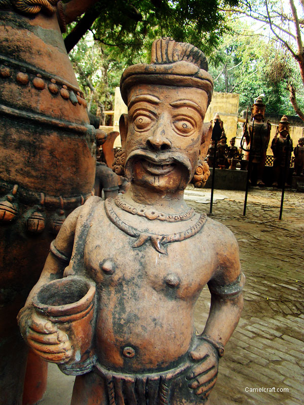 A Man sculpture made of Terracotta displayed at Craft Museum of Delhi, India, the Example of old Indian teraacotta technique